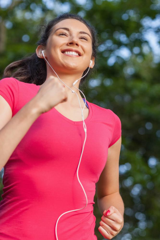 woman exercising with earphones - Gamesforlanguage.com