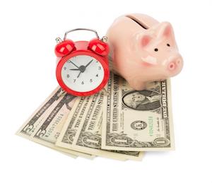 piggy bank with money and alarm clock