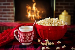 warm and cozy: popcorn in front of fireplace  Pixabay