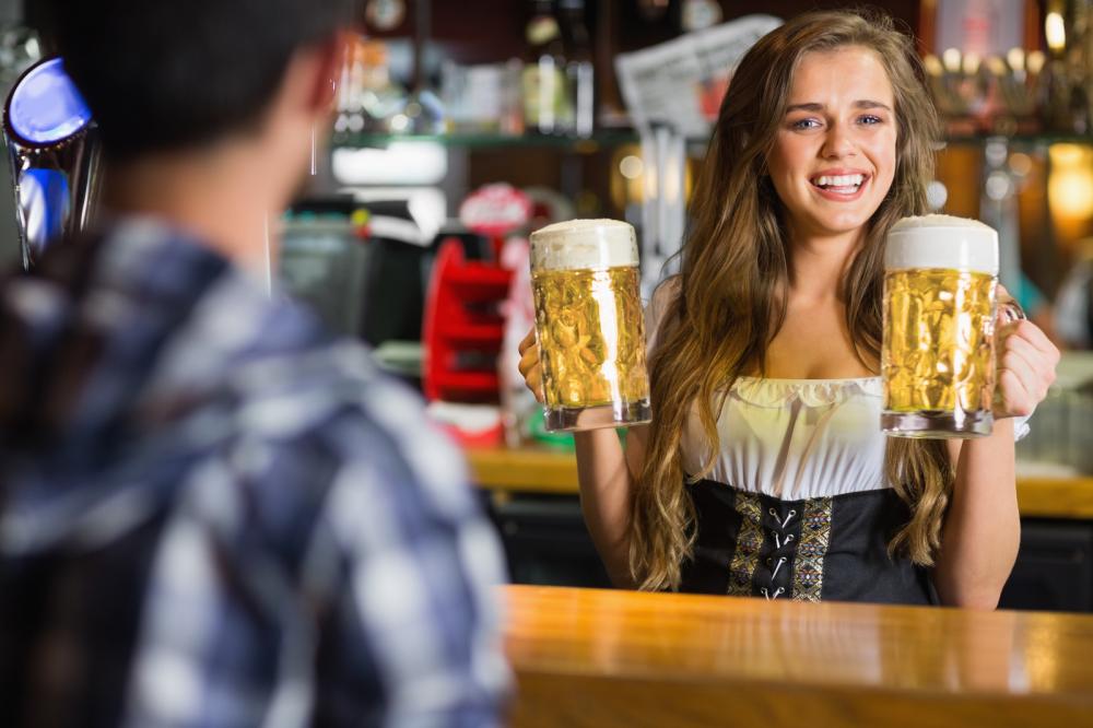 German barmaid serving beer - Gamesforlanguage.com