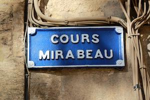 Cours Mirabeau sign surrounded by wires