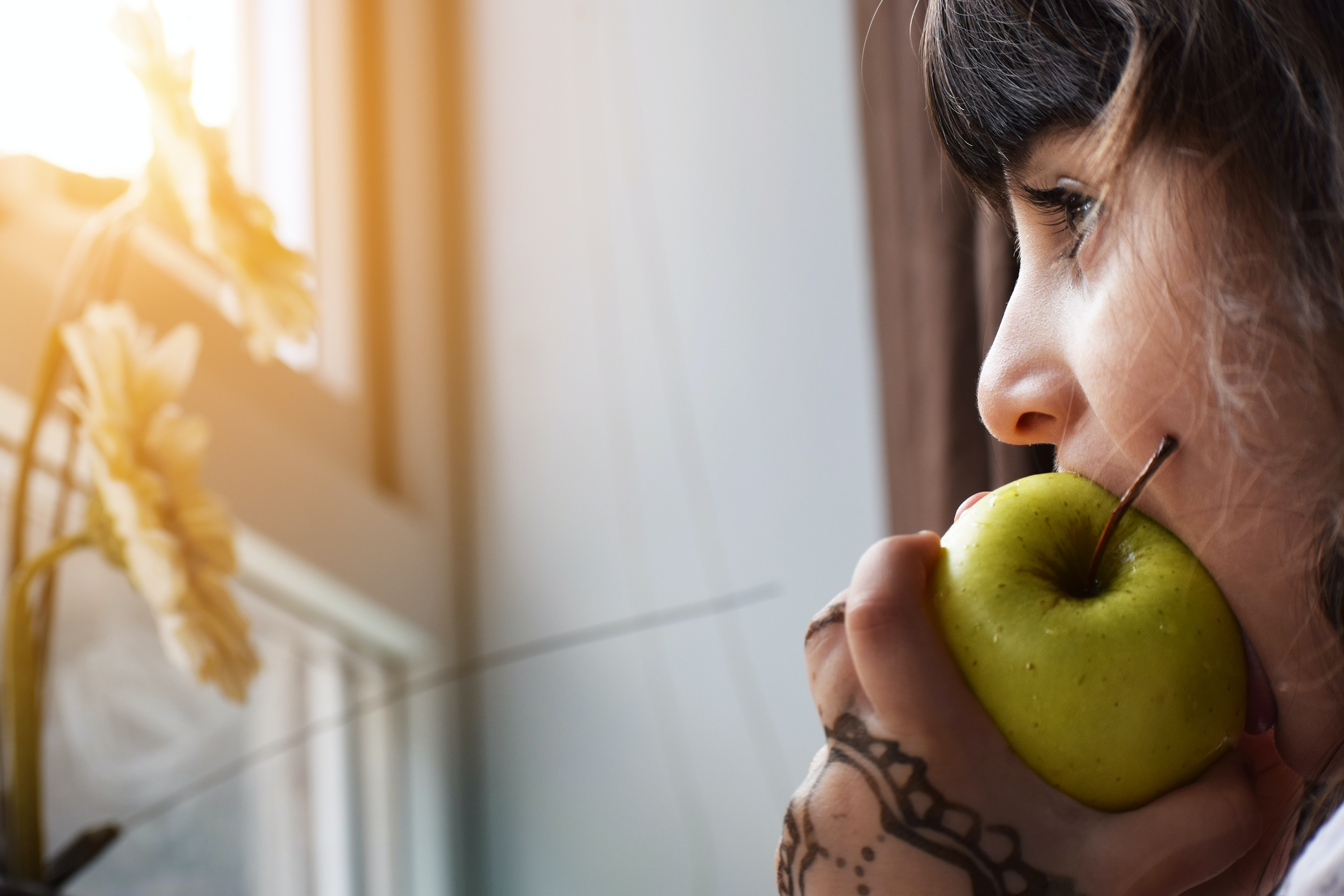 Biting in a sour apple