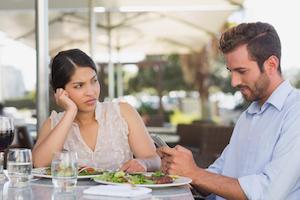 Bored woman ignored by her date