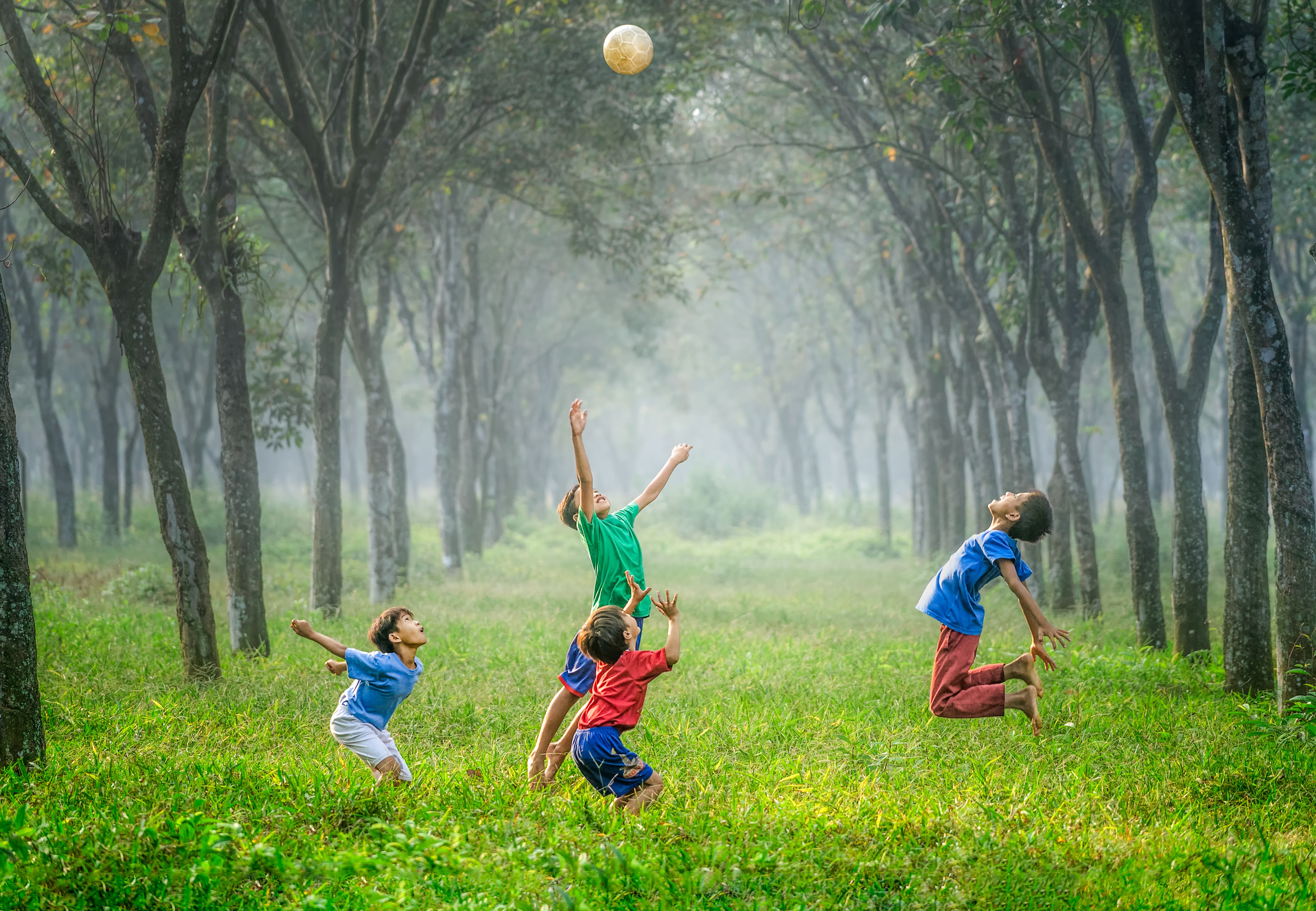 Four boys playing ball