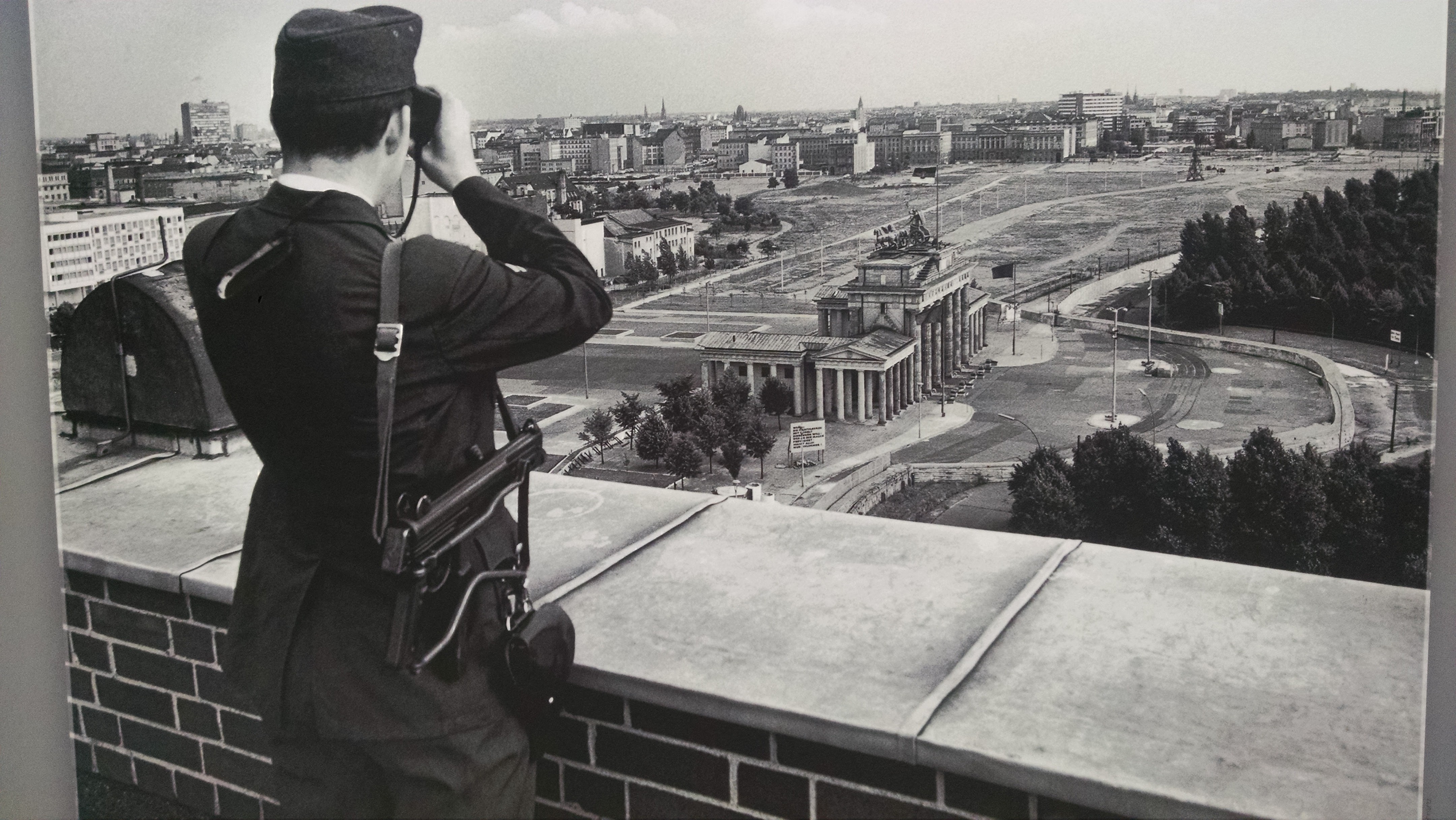 Volkspolizist watching Brandenburger Tor before 1990 