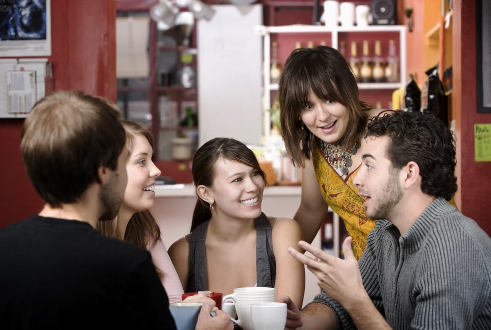 Friends discussing in coffee house