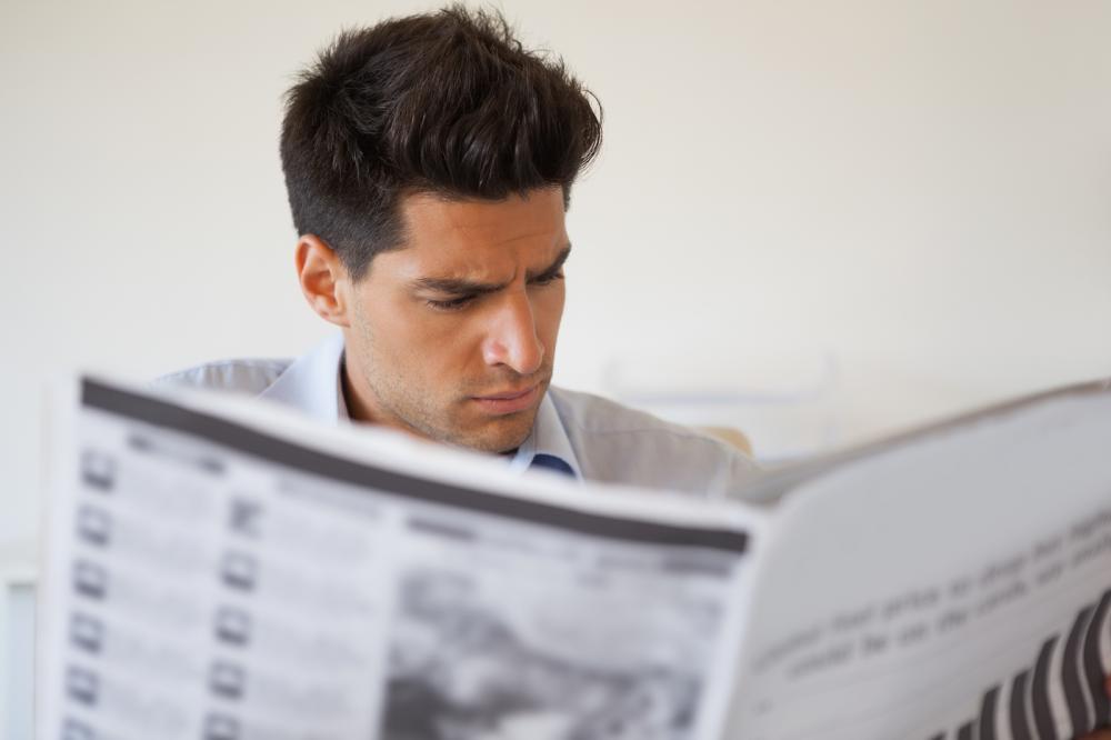 Man reading newspaper