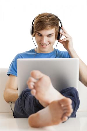 young man listening to Italian podcast