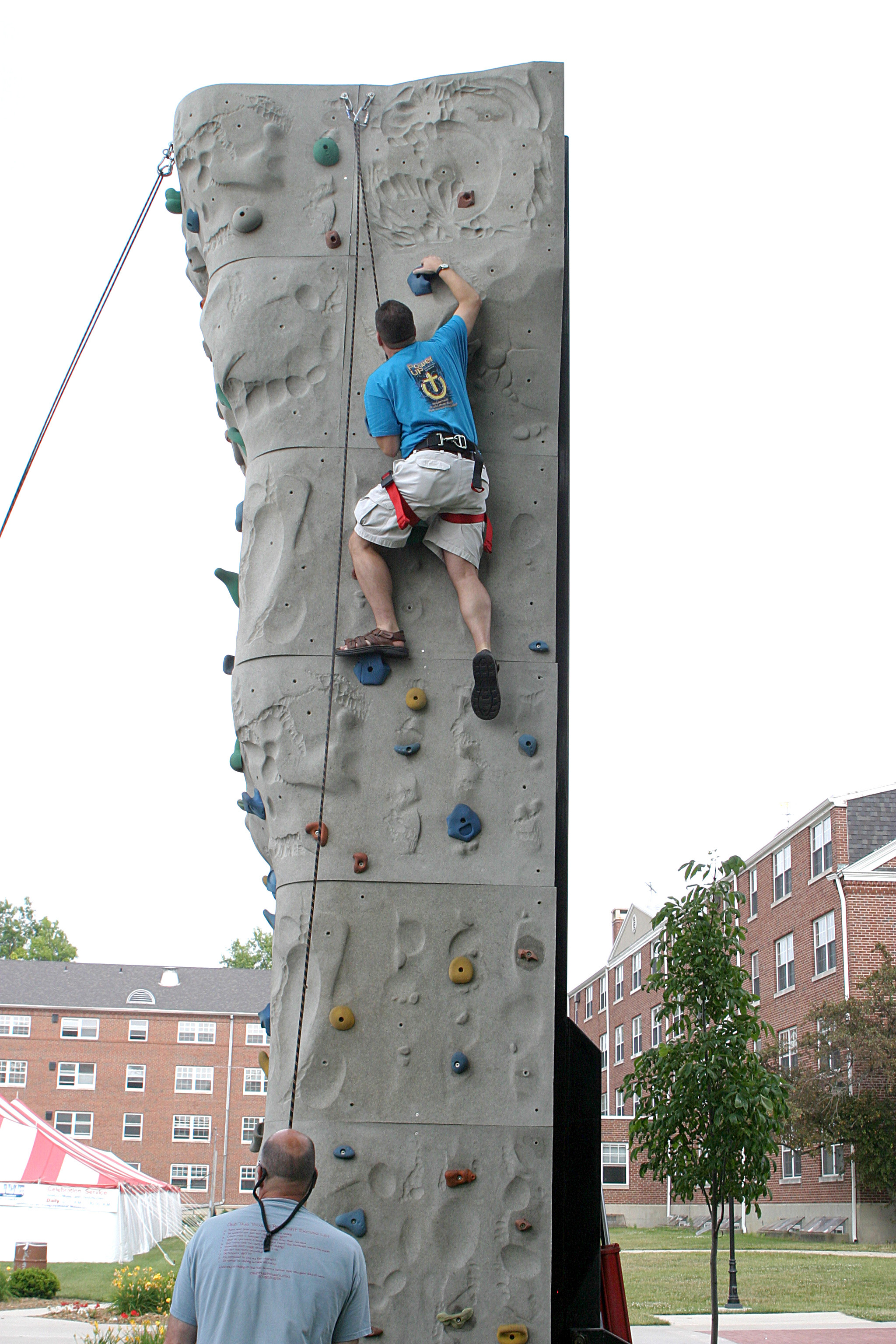 man climbing wall